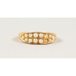 AN 18CT GOLD AND PEARL RING.