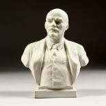 A RUSSIAN BISQUE PORCELAIN BUST OF LENIN. 7ins high.