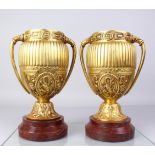 A GOOD PAIR OF 19TH CENTURY FRENCH, BRONZE TWO-HANDLED COUPES, on circular marble bases. 12ins