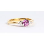 AN 18CT GOLD, PINK SAPPHIRE AND DIAMOND RING.