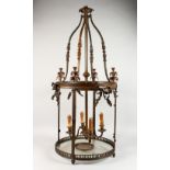 A LARGE GEORGE III DESIGN BRONZE HALL LANTERN, with four curving arms, fitted for electricity (