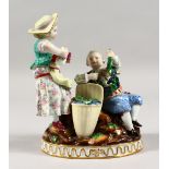 A 19TH CENTURY MEISSEN PORCELAIN GROUP OF A YOUNG BOY AND GIRL, holding fruiting vines, with a