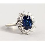 A VERY GOOD 18CT WHITE GOLD, SAPPHIRE AND DIAMOND RING.