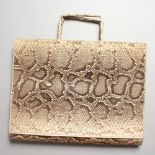 A LADIES SNAKESKIN HANDBAG.