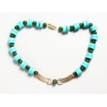 AN 18CT GOLD, DIAMOND, TURQUOISE AND JADE NECKLACE.