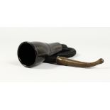 AN EARLY BAKELITE HEARING AID, of trumpet form with braided rubber hose. 44ins long.