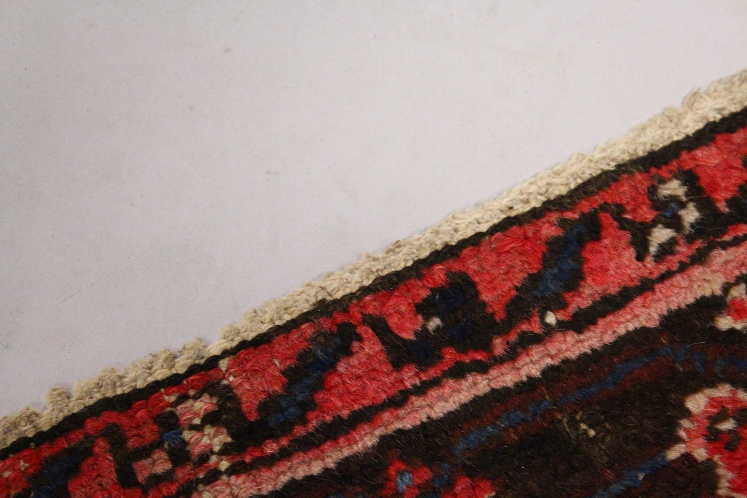 A PERSIAN RUG, 20TH CENTURY, red ground with central medallion, within a dark blue border. 6ft 10ins - Image 2 of 9