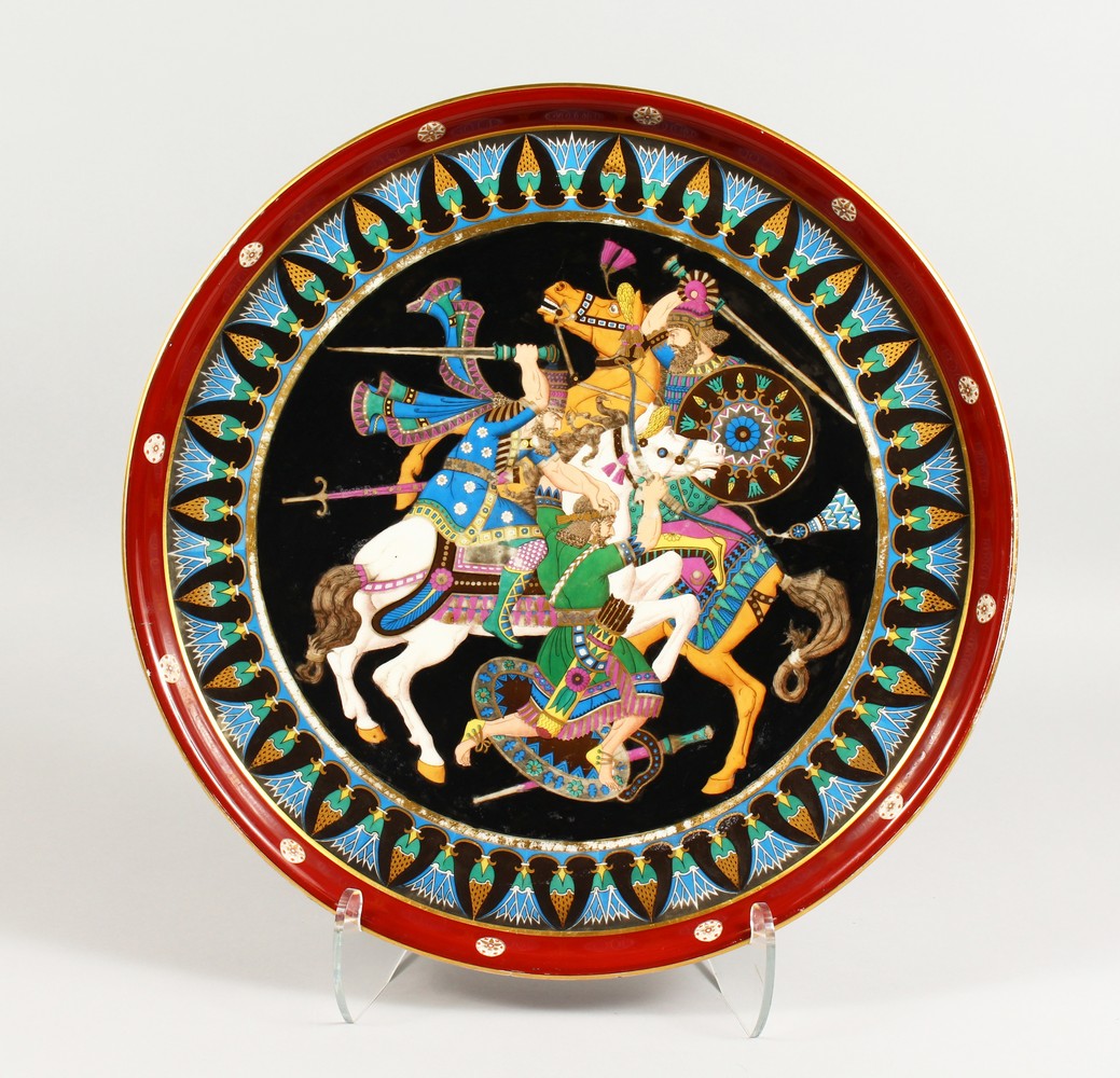 A SUPERB LARGE PORCELAIN CIRCULAR CHARGER, with a Russian scene of warriors on horseback. 18.5ins