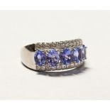 A SILVER REAL TANZANITE RING.