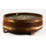 A GEORGE III DESIGN MAHOGANY AND METAL BOUND OVAL WINE COOLER OR JARDINIERE, with zinc liner, on