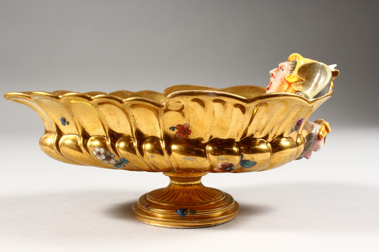 A BERLIN GILT PORCELAIN SAUCEBOAT, with grotesque mask, the centre painted with cupids. 8ins - Image 5 of 11