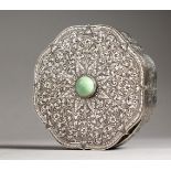 A .800 SILVER CIRCULAR SHAPED BOX AND COVER, with jade stone handle. 5.5ins diameter.