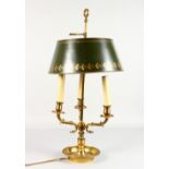 A 19TH CENTURY FRENCH, BRASS AND TOLEWARE STUDENTS LAMP on a circular base. 25ins high.