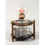 A SMALL NOVELTY AQUARIUM TABLE CLOCK. 6ins high.