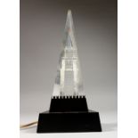 A RUSSIAN NOVELTY PERSPEX TABLE LAMP, depicting a clock tower. 12.5ins high.