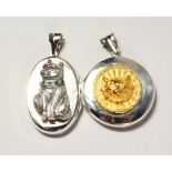 TWO SILVER CAT LOCKETS.