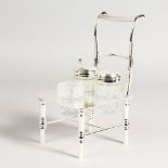 A NOVELTY SILVER PLATED CRUET, modelled as a chair. 8ins high.