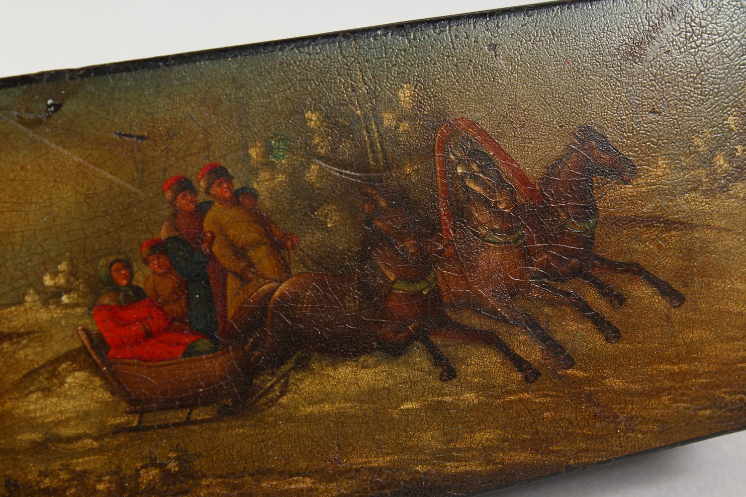 A RUSSIAN LACQUER RECTANGULAR BOX, painted with figures and horses pulling a sleigh. 6.75ins long. - Image 2 of 4