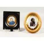 A PORTRAIT MINIATURE OF A GIRL IN A BLUE DRESS, and an oval silhouette on glass. 5ins x 4.5ins and
