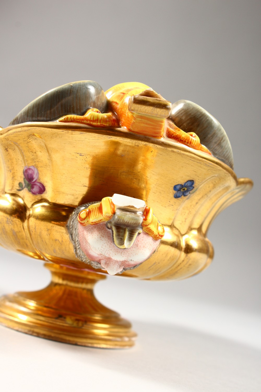 A BERLIN GILT PORCELAIN SAUCEBOAT, with grotesque mask, the centre painted with cupids. 8ins - Image 6 of 11