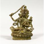 A MINIATURE BRONZE FIGURE OF A SEATED DEITY. 3.25ins high.