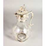 A VICTORIAN STYLE ETCHED GLASS AND PLATED CLARET JUG. 12ins high.