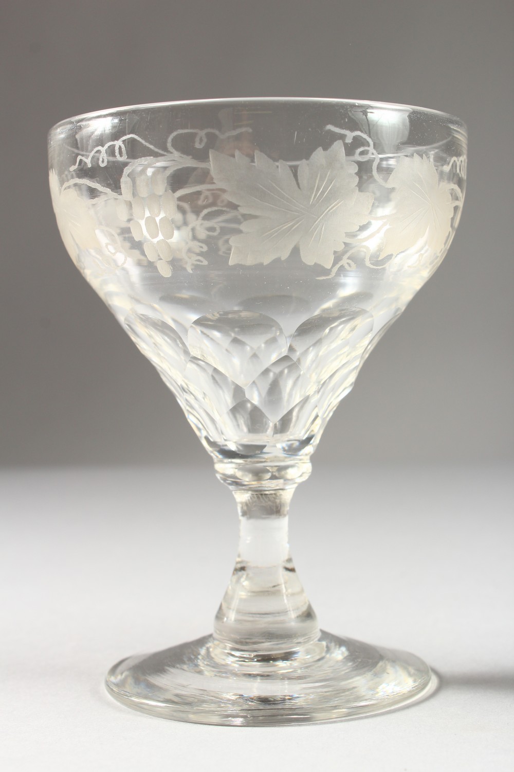 A SUITE OF GLASSWARE, etched with fruiting vines, comprising six large wine glasses and twelve other - Image 2 of 13