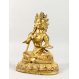 A GILT BRONZE FIGURE OF A SEATED DEITY. 8ins high.