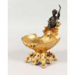 A FRENCH STYLE GILT BRONZE SHELL SHAPED TABLE SALT, mounted with a bronze cherub. 7ins high.