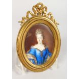 A GOOD 19TH CENTURY OVAL PORTRAIT MINIATURE, of a lady wearing a blue dress, in an ornate ormolu