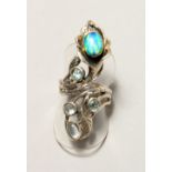 A SILVER ART DECO DESIGN OPAL AND BLUE TOPAZ RING.