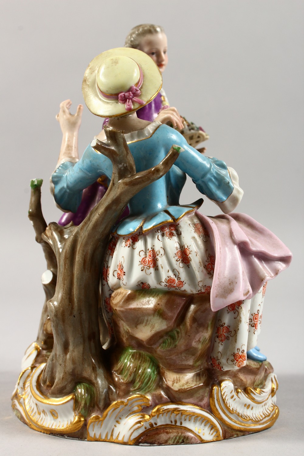 A 19TH CENTURY MEISSEN PORCELAIN GROUP OF A GALLANT AND LADY, with basket of fruit and flowers. - Image 3 of 8