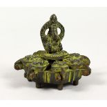 AN INDIAN BRONZE SEVEN SECTION SPICE BOX. 2.75ins wide.