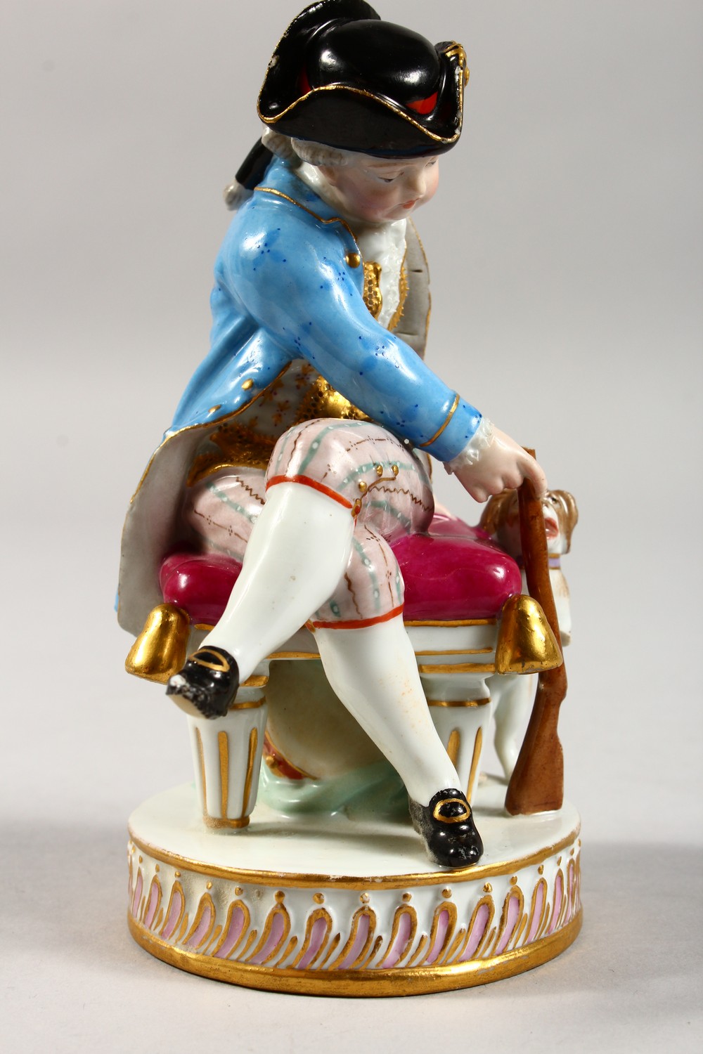 A 19TH CENTURY MEISSEN PORCELAIN FIGURE OF A BOY, seated on a stool holding a gun, dog by his - Image 4 of 13