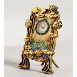 A SUPERB RUSSIAN SILVER, GILT AND ENAMEL CLOCK, in the Art Deco style with lilies and blue enamel,