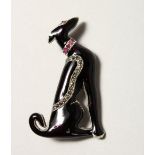 A SILVER ART DECO DESIGN RUBY SET DOG BROOCH.