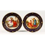 A SUPERB PAIR OF 19TH CENTURY VIENNA CIRCULAR PLATES, "ACHILLES SCHWERT UND LANDALEN" and "