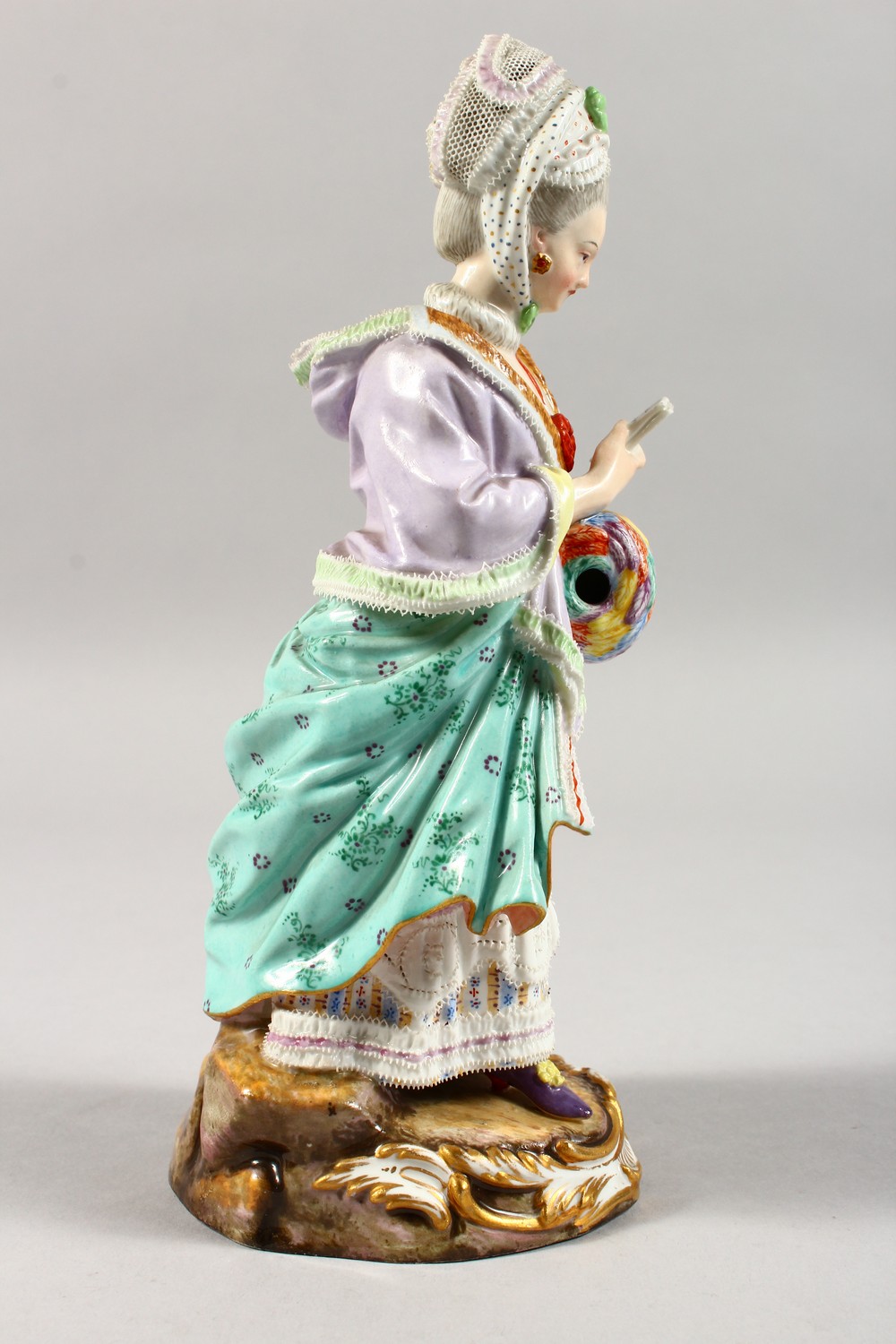 A GOOD 19TH CENTURY MEISSEN PORCELAIN FIGURE OF A LADY with muff, reading a book. Cross swords - Image 4 of 14