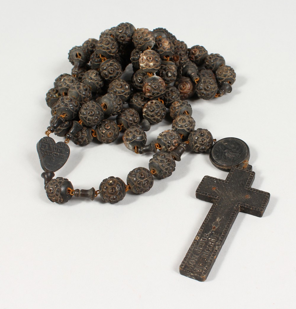 A ROSARY BEAD NECKLACE.