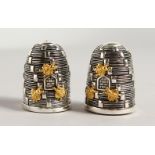 A PAIR OF .800 SILVER BEEHIVE SALT AND PEPPERS. 1.5ins high.