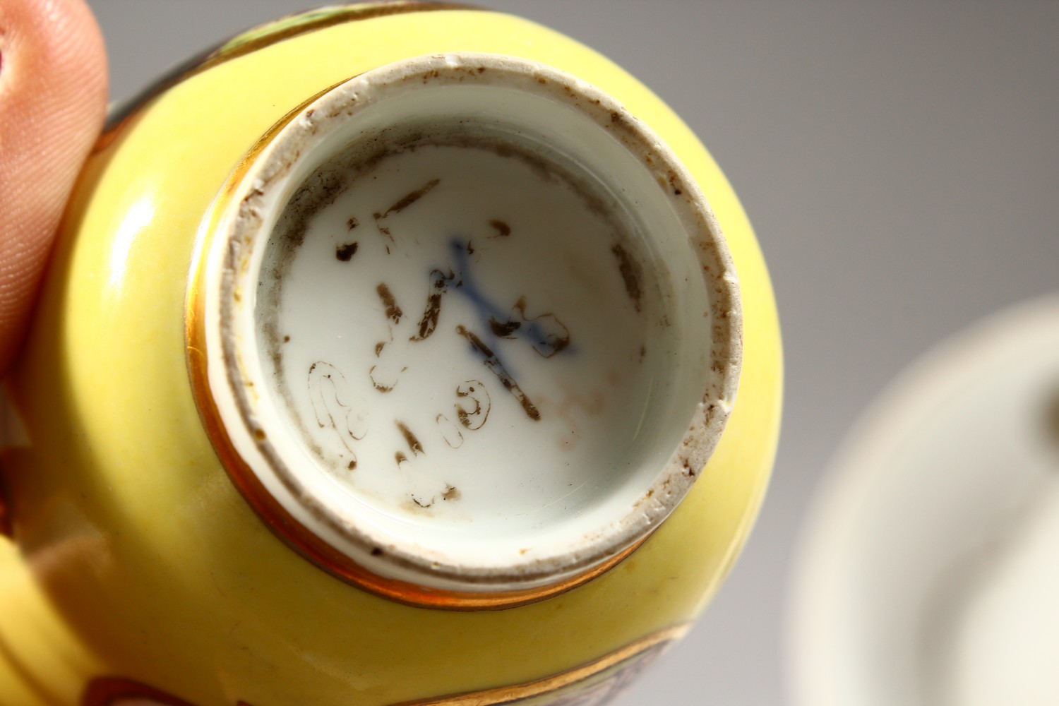 A SUPERB 18TH CENTURY MEISSEN CUP AND SAUCER, with yellow ground, the cup painted with two landscape - Image 9 of 13