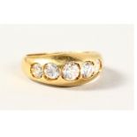 AN 18CT GOLD FIVE STONE DIAMOND RING.