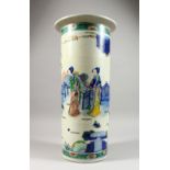 A CHINESE POTTERY STICK STAND, painted with figures in a landscape. 19.5ins high. AF