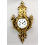 A BRONZE CASED CARTEL WALL CLOCK, with white porcelain dial. 26.5ins high.