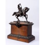 A SUPERB BRONZE TOUR MODEL, warrior on horseback, on a bronze and wooden plinth. 14ins high.