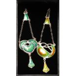 A PAIR OF SILVER AND ENAMEL ARTS & CRAFTS DESIGN PENDANTS.