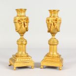 A GOOD PAIR OF LOUIS XVI ORMOLU CASSOLETTES with reversible sconces. 8.5ins high.