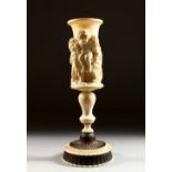 A SUPERB 19TH CENTURY CARVED IVORY PEDESTAL CHALICE, the sides carved with five young children, on a