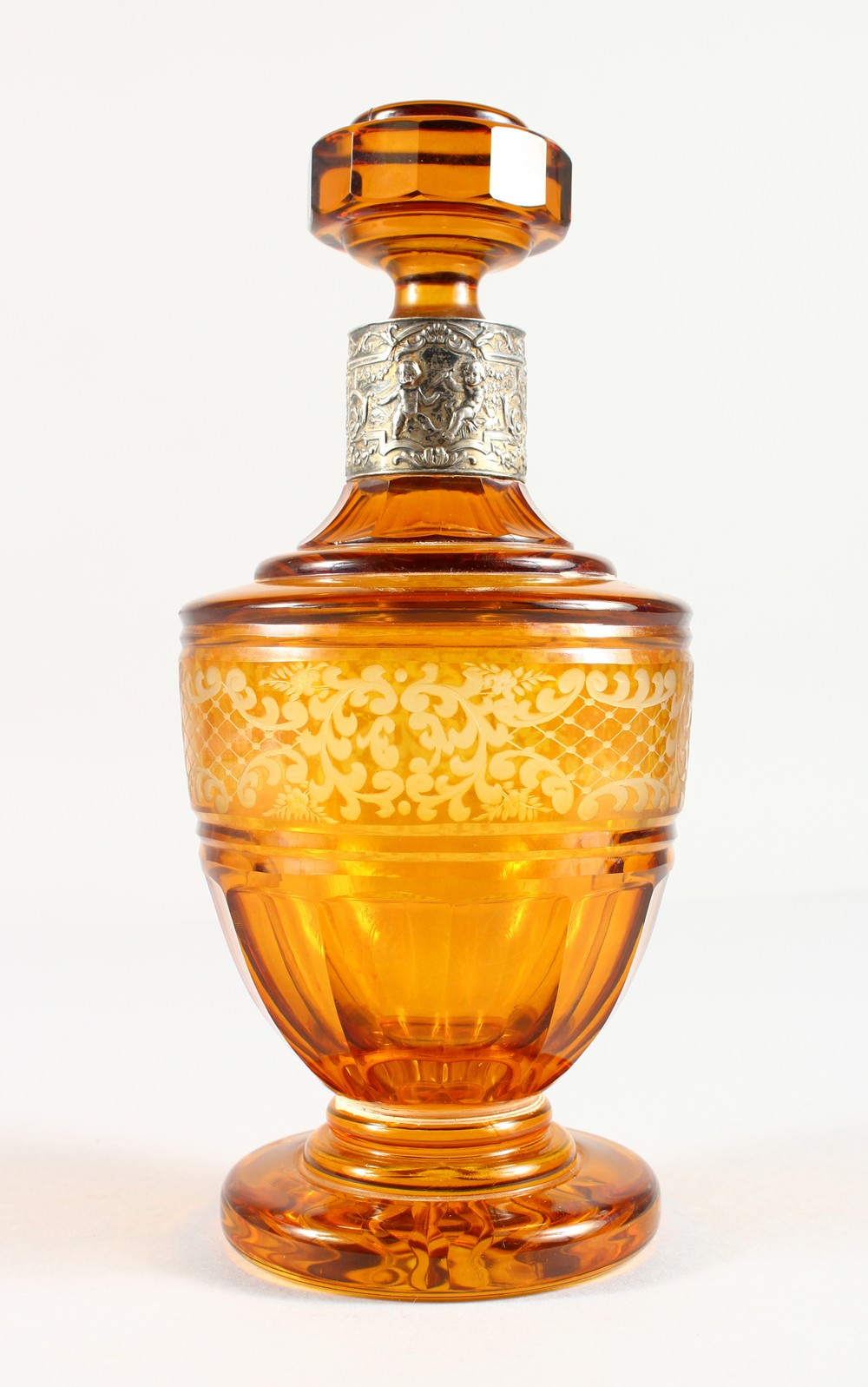 A BOHEMIAN AMBER ENGRAVED SCENT BOTTLE AND STOPPER, with silver band. 10ins high.