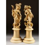 A GOOD PAIR OF 19TH CENTURY CARVED EUROPEAN IVORIES OF A GALLANT AND YOUNG LADY, on circular